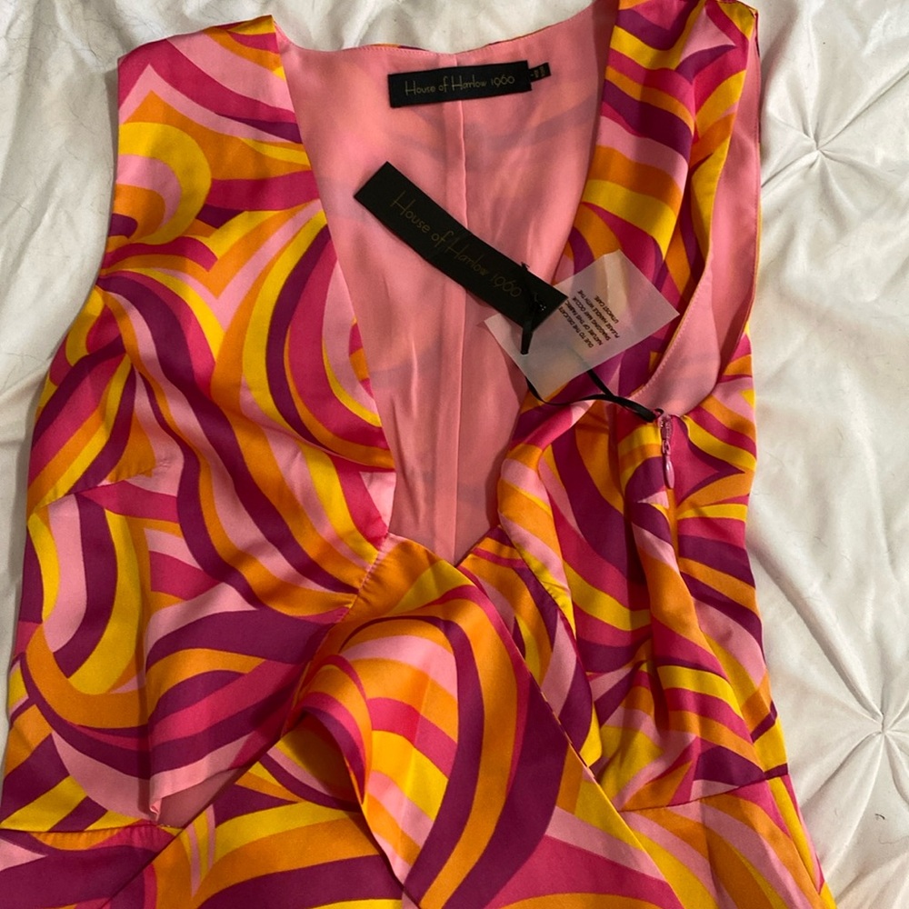 New with tag- house of Harlow romper. Size small